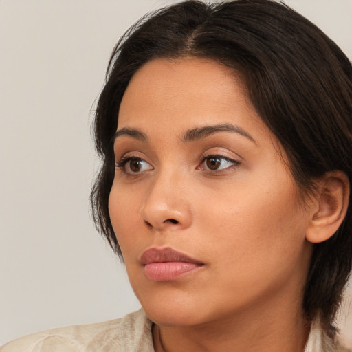 Neutral white young-adult female with medium  brown hair and brown eyes