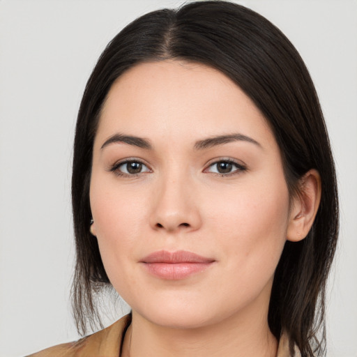 Joyful white young-adult female with long  brown hair and brown eyes