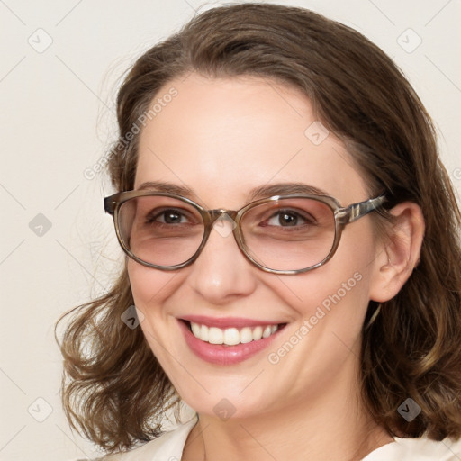 Joyful white young-adult female with medium  brown hair and blue eyes