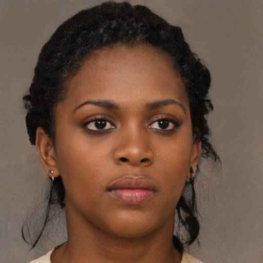 Neutral black young-adult female with medium  black hair and brown eyes