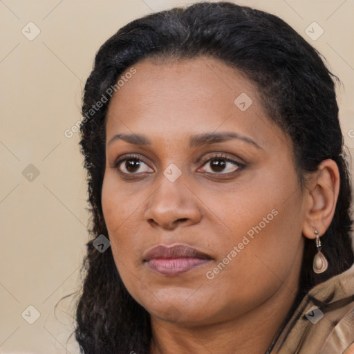 Joyful latino young-adult female with long  black hair and brown eyes