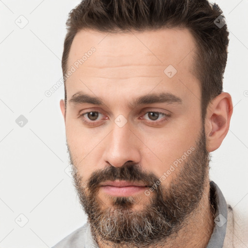 Neutral white young-adult male with short  brown hair and brown eyes