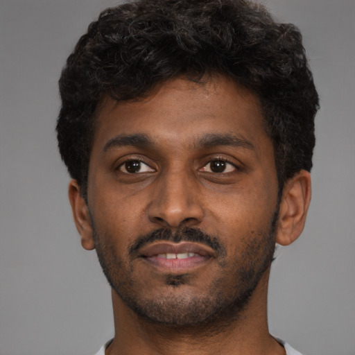Neutral black young-adult male with short  brown hair and brown eyes