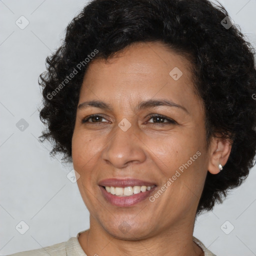 Joyful latino adult female with short  brown hair and brown eyes