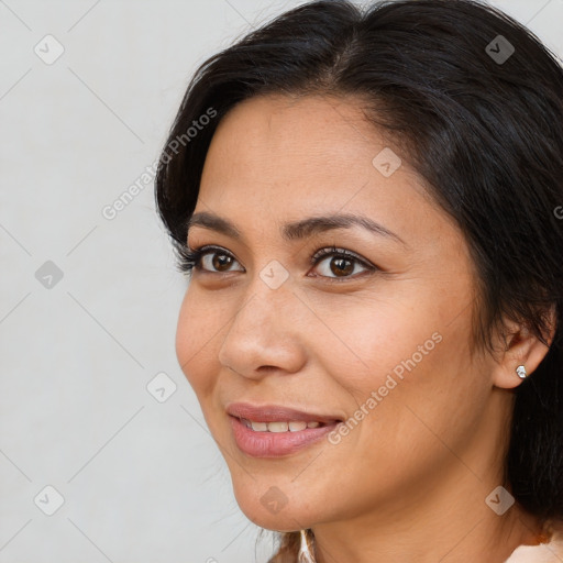 Joyful white adult female with medium  brown hair and brown eyes