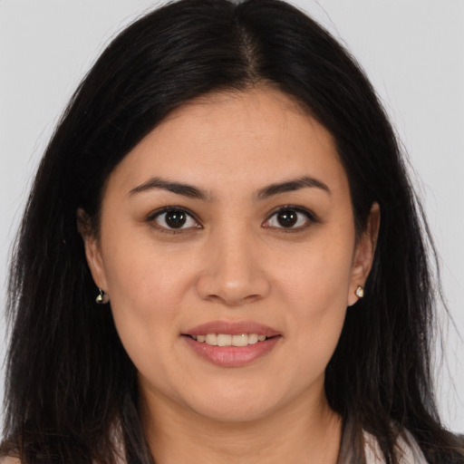 Joyful white young-adult female with long  brown hair and brown eyes