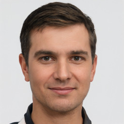 Joyful white young-adult male with short  brown hair and brown eyes