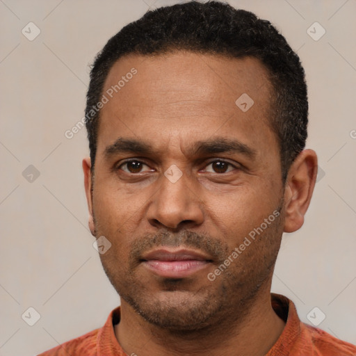 Neutral latino adult male with short  black hair and brown eyes