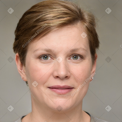 Joyful white adult female with short  brown hair and grey eyes