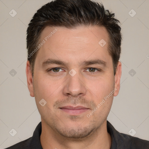 Joyful white adult male with short  brown hair and brown eyes