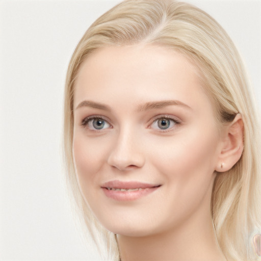 Joyful white young-adult female with long  brown hair and blue eyes