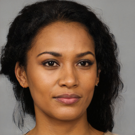 Joyful black young-adult female with medium  black hair and brown eyes