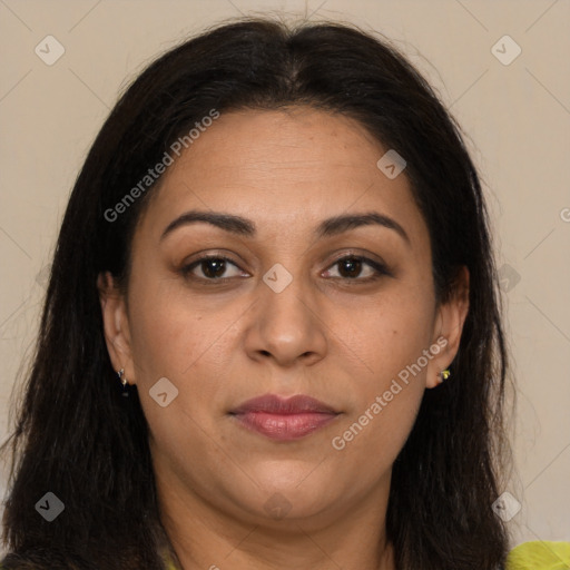 Joyful latino adult female with long  brown hair and brown eyes