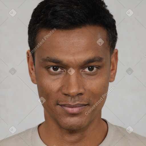 Joyful black young-adult male with short  black hair and brown eyes