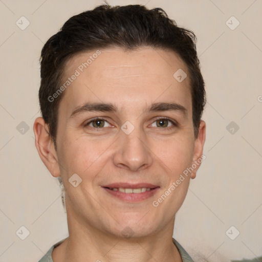 Joyful white adult male with short  brown hair and grey eyes