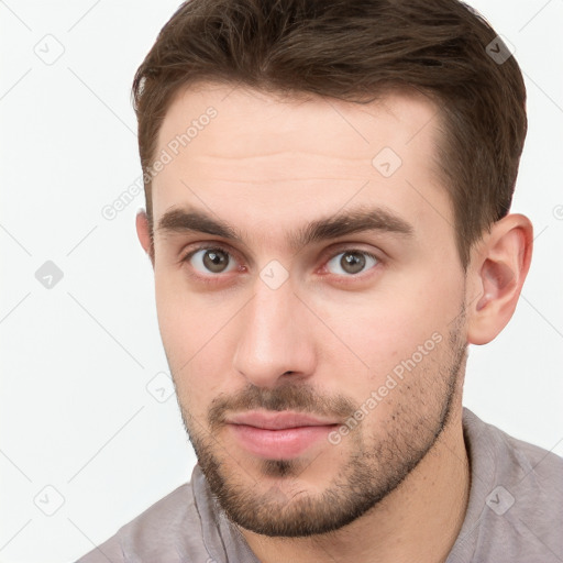 Neutral white young-adult male with short  brown hair and brown eyes