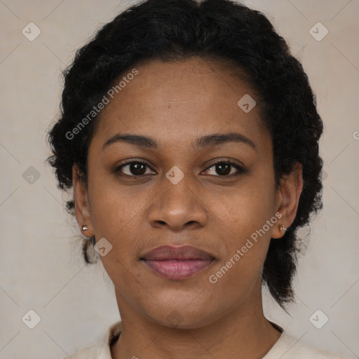 Joyful black young-adult female with short  brown hair and brown eyes