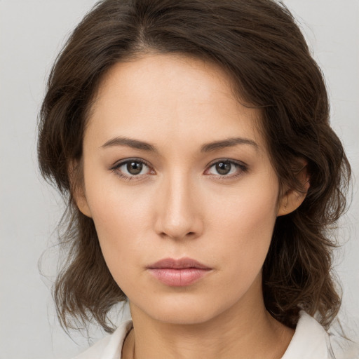 Neutral white young-adult female with medium  brown hair and brown eyes