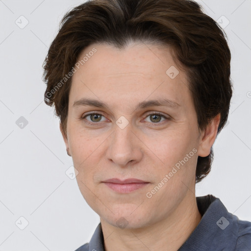 Joyful white adult female with short  brown hair and grey eyes