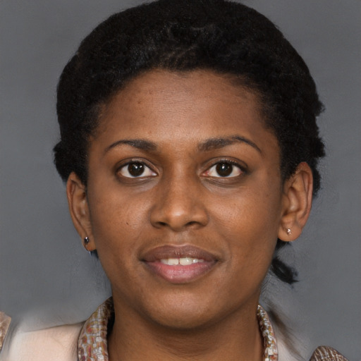 Joyful black young-adult female with medium  brown hair and brown eyes