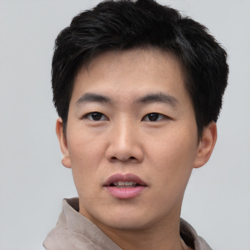 Neutral asian young-adult male with short  black hair and brown eyes