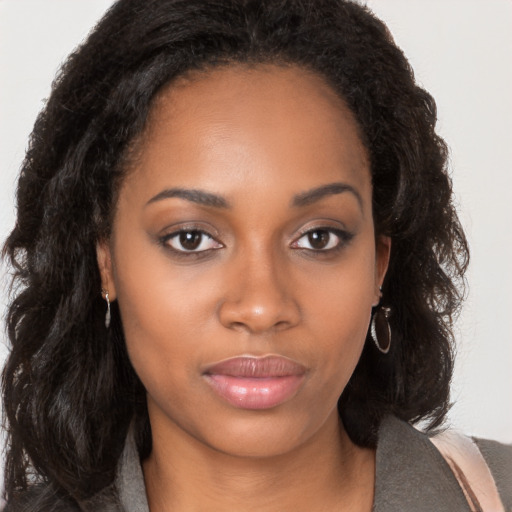 Neutral black young-adult female with long  brown hair and brown eyes