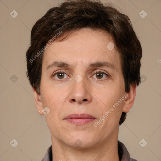 Joyful white adult male with short  brown hair and grey eyes