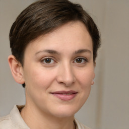 Joyful white young-adult female with medium  brown hair and grey eyes