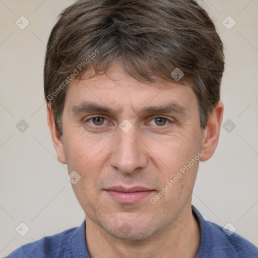 Joyful white adult male with short  brown hair and grey eyes