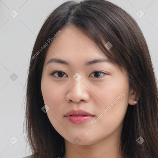 Joyful asian young-adult female with long  brown hair and brown eyes