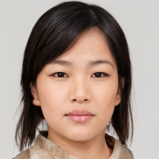 Neutral asian young-adult female with medium  brown hair and brown eyes