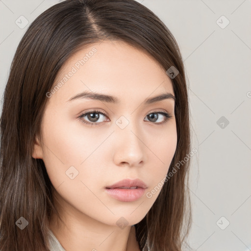 Neutral white young-adult female with long  brown hair and brown eyes