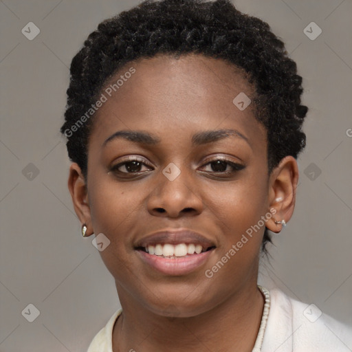 Joyful black young-adult female with short  black hair and brown eyes