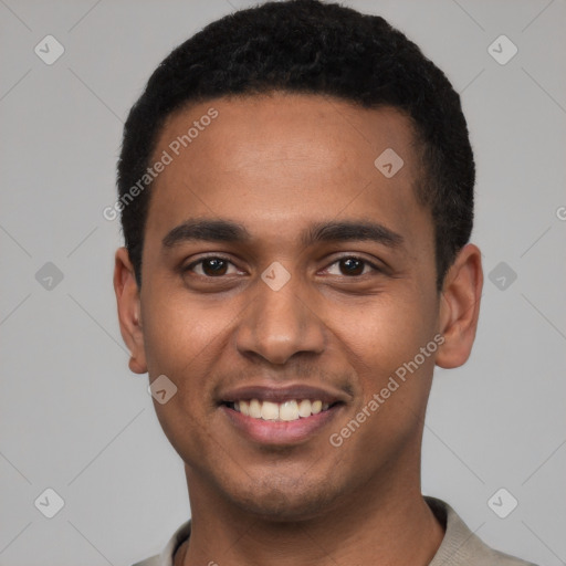 Joyful black young-adult male with short  black hair and brown eyes