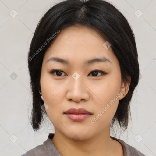 Neutral asian young-adult female with medium  black hair and brown eyes