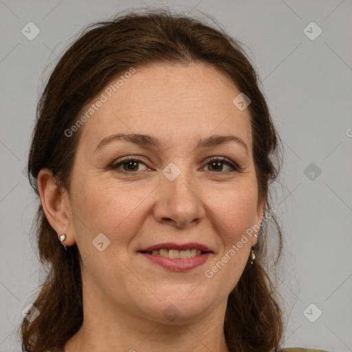 Joyful white adult female with medium  brown hair and grey eyes