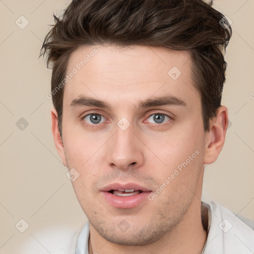 Neutral white young-adult male with short  brown hair and brown eyes