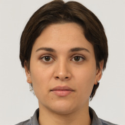 Neutral white young-adult female with short  brown hair and brown eyes