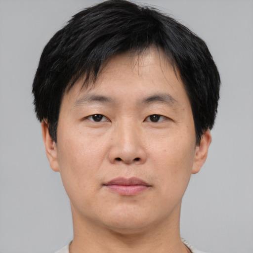 Neutral asian young-adult male with short  black hair and brown eyes