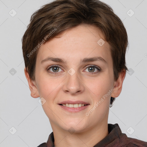 Joyful white young-adult female with short  brown hair and grey eyes