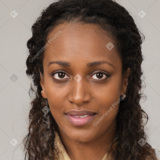 Joyful black young-adult female with long  brown hair and brown eyes