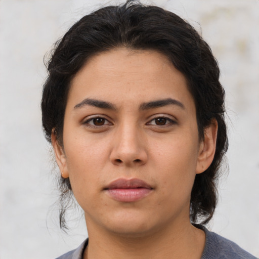 Neutral latino young-adult female with medium  brown hair and brown eyes