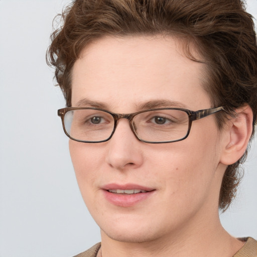 Joyful white adult female with short  brown hair and blue eyes