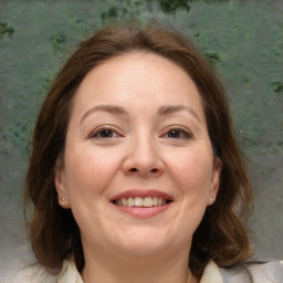 Joyful white adult female with medium  brown hair and brown eyes