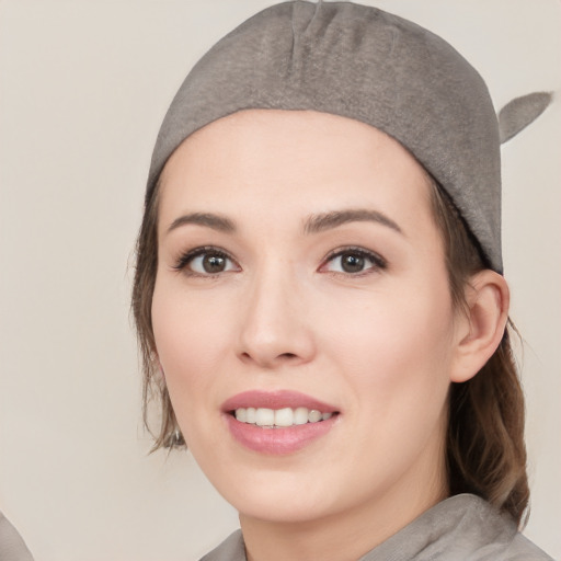 Joyful white young-adult female with medium  black hair and brown eyes