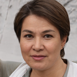 Joyful white adult female with short  brown hair and brown eyes