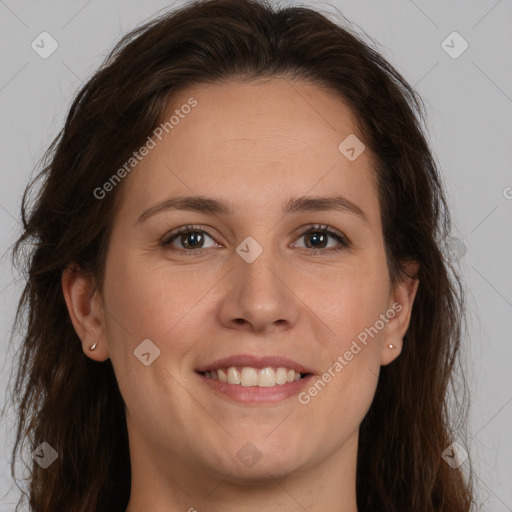 Joyful white young-adult female with long  brown hair and brown eyes