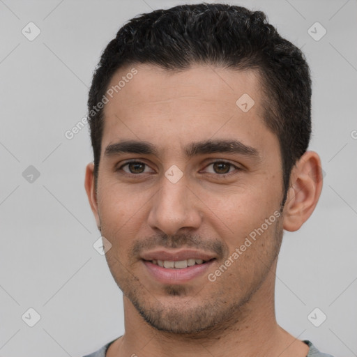 Joyful white young-adult male with short  brown hair and brown eyes