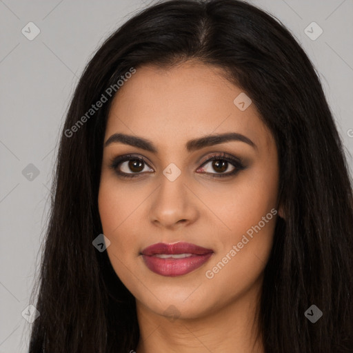 Joyful latino young-adult female with long  brown hair and brown eyes