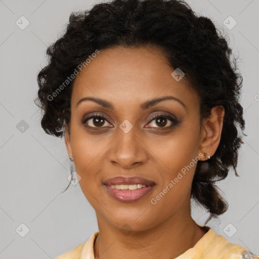 Joyful black young-adult female with medium  brown hair and brown eyes